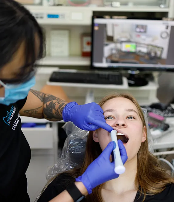 Dental assistant inspecting a patient's gums - Harmony Family Dentistry in Vancouver WA